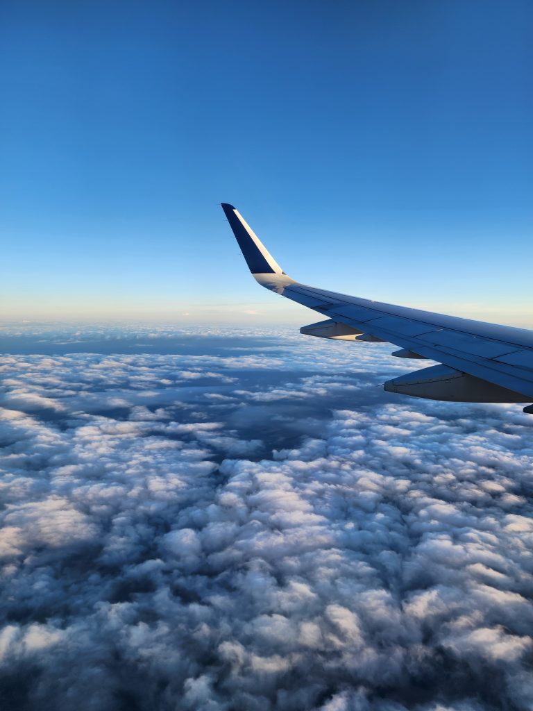 Plane wing in the cloud